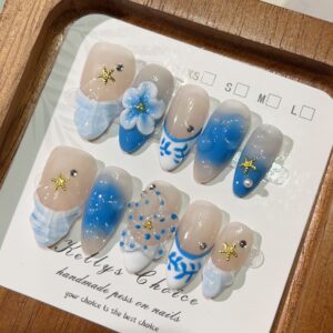 Handmade Bold Almond Nails with 3D Floral Design and Blush Accent.